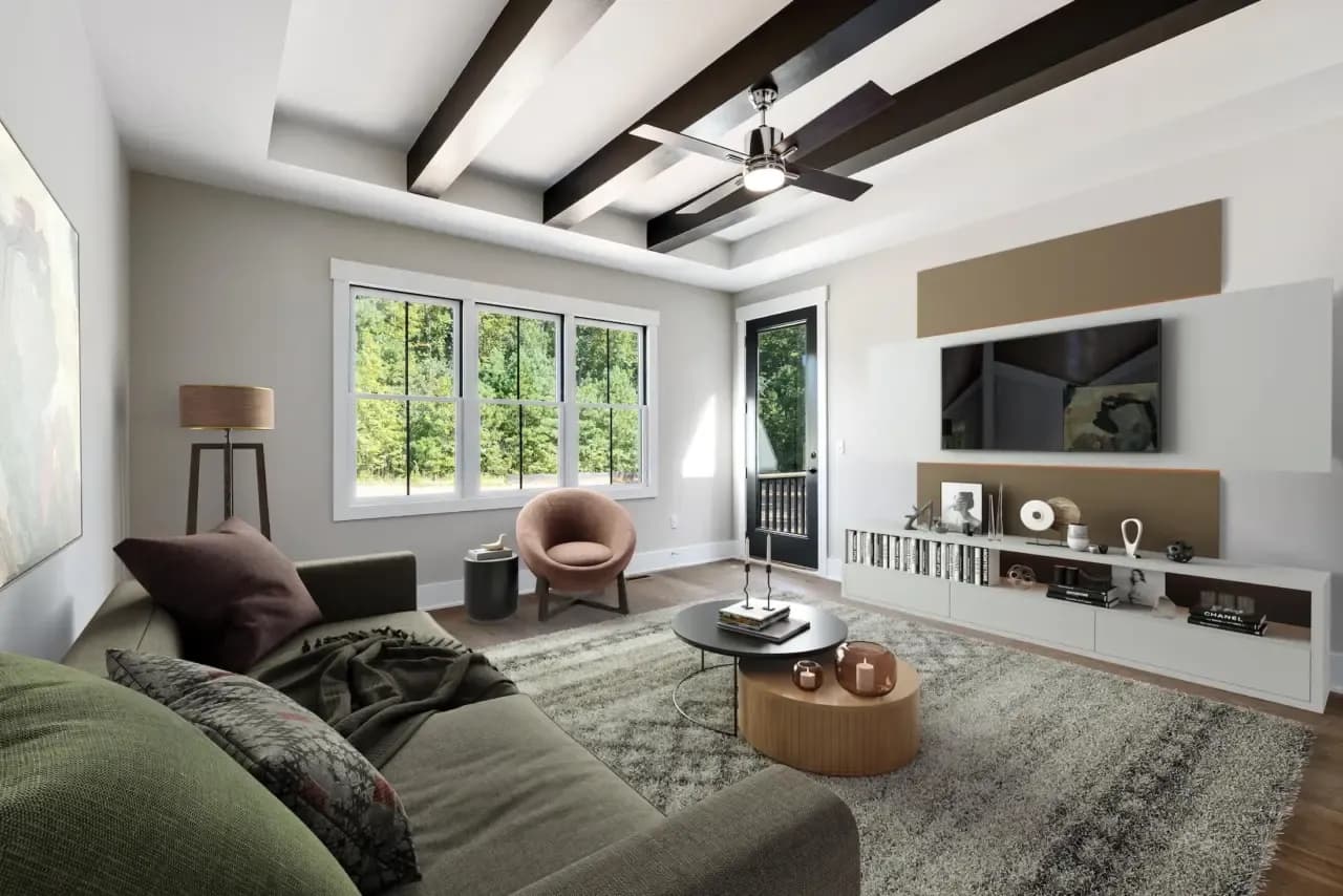 Same room virtually staged with a sofa, armchair, rug and television console